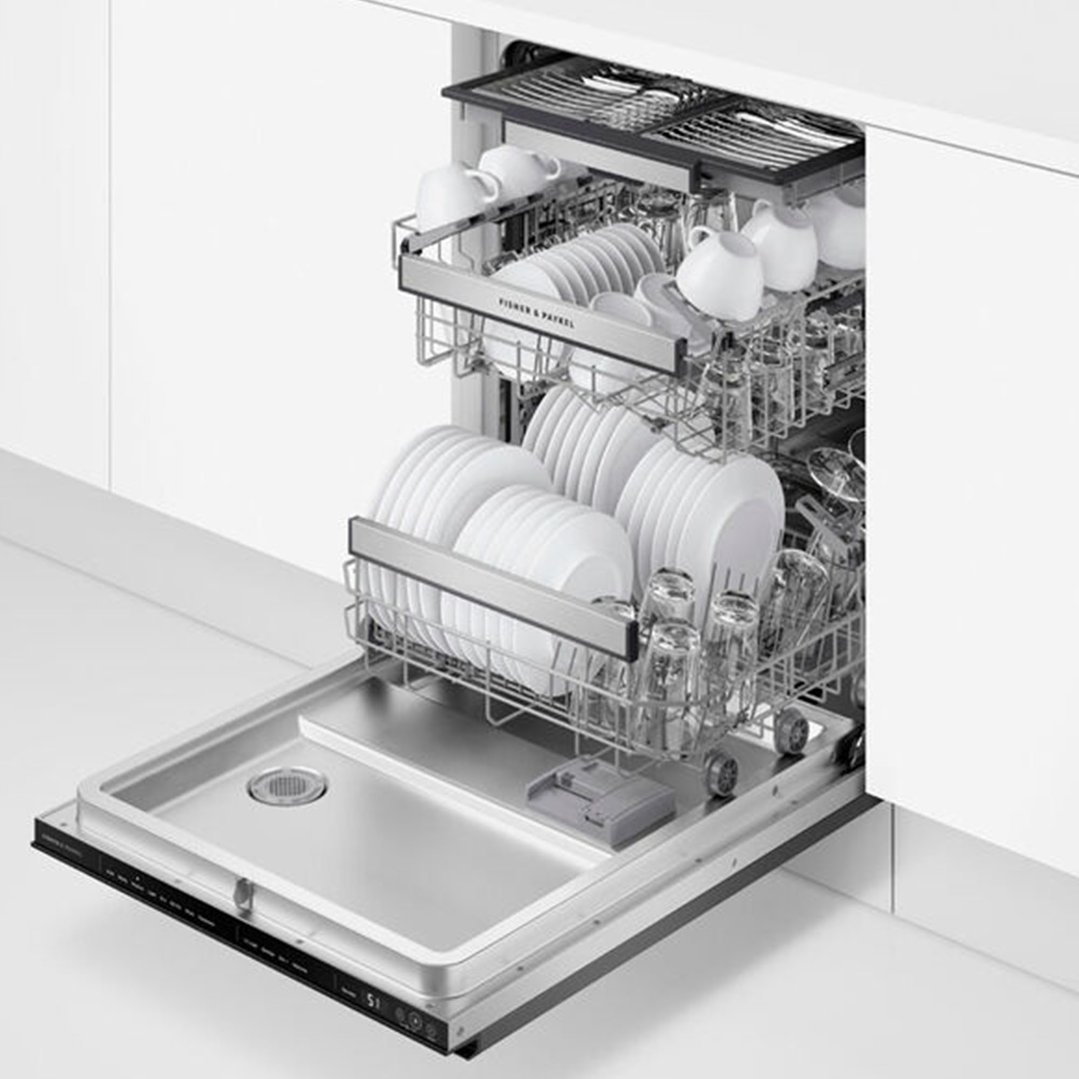 Open dishwasher with two racks full of white dishes and clear glasses
