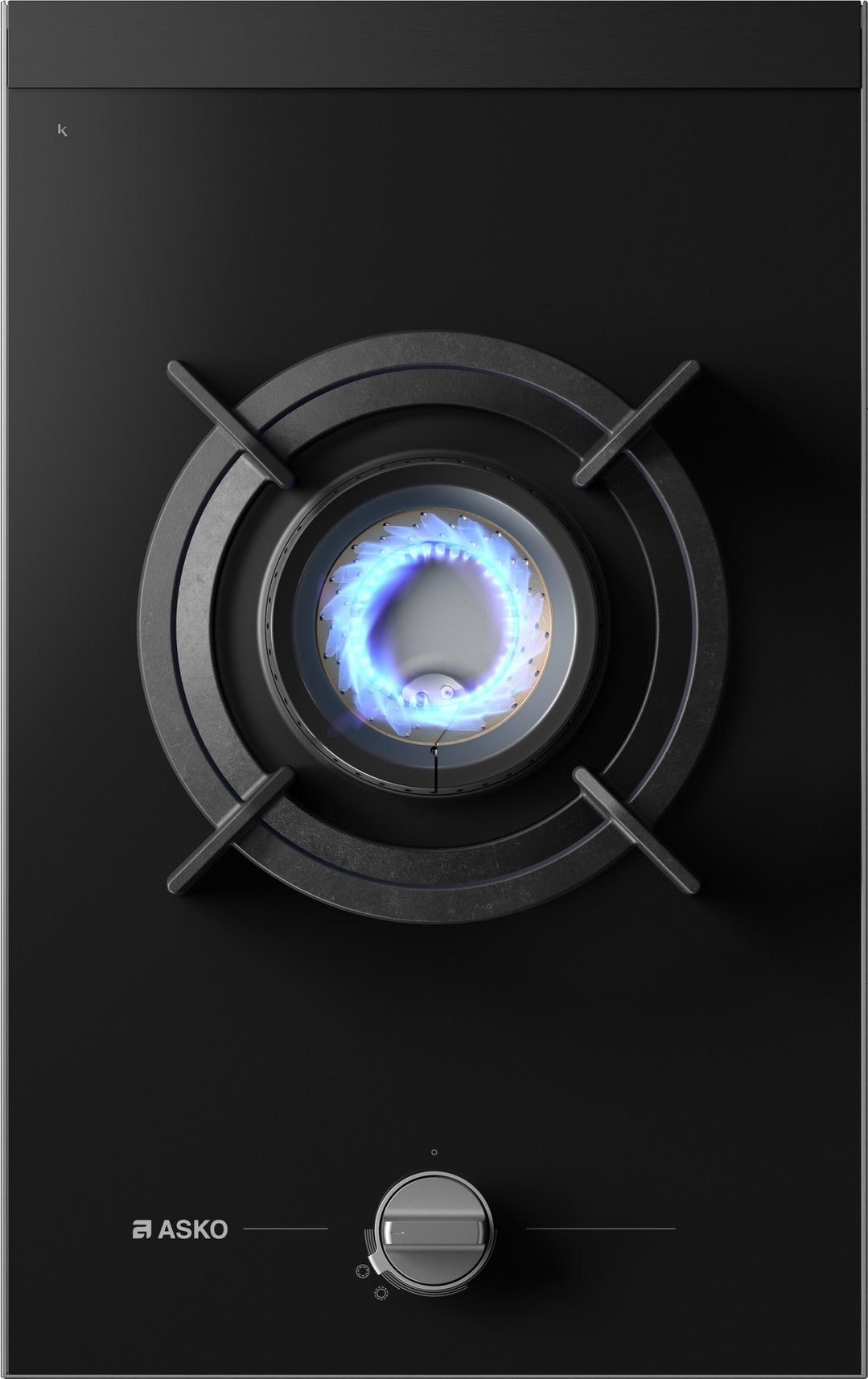 Close up of a black gas cooktop with one lit burner and control knob