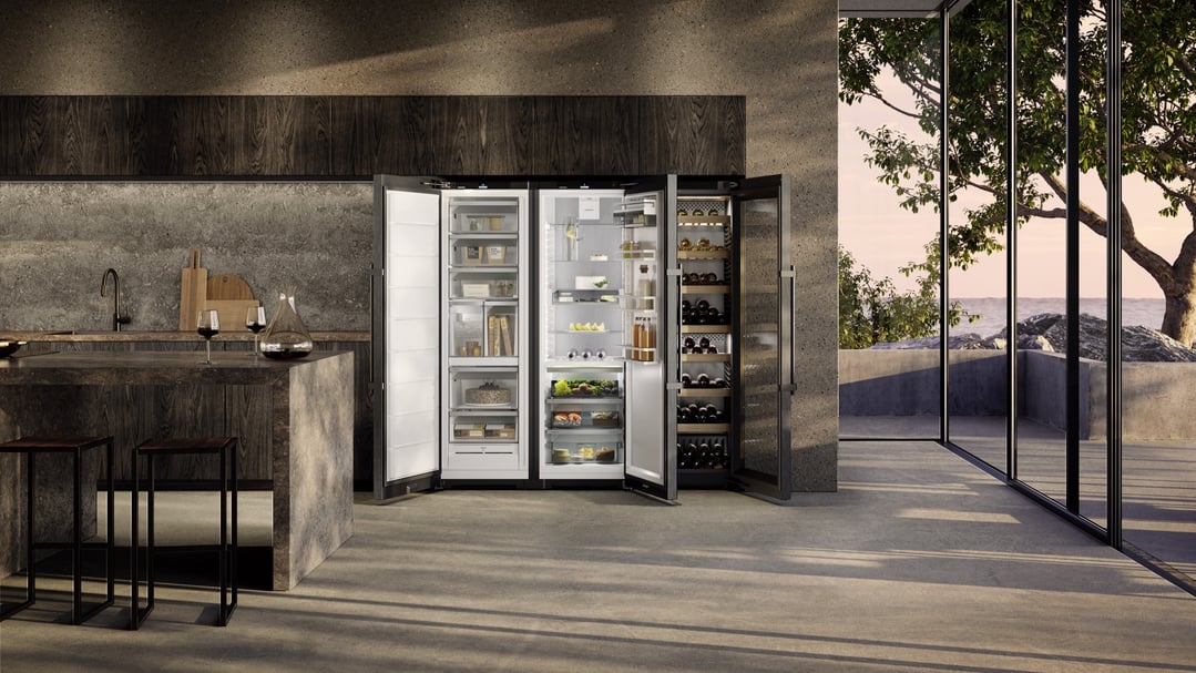 Three wine fridges and a refrigerator in a modern kitchen with a view