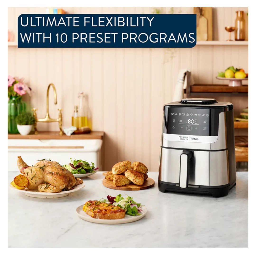 Jamie Oliver by Tefal Quiet & Easy Air fryer on a kitchen counter with food