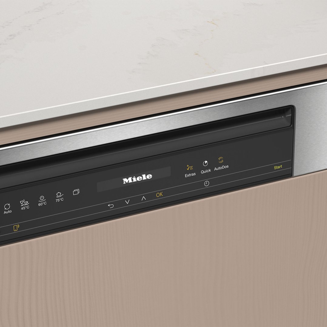 Close up of a Miele dishwasher control panel in a kitchen setting
