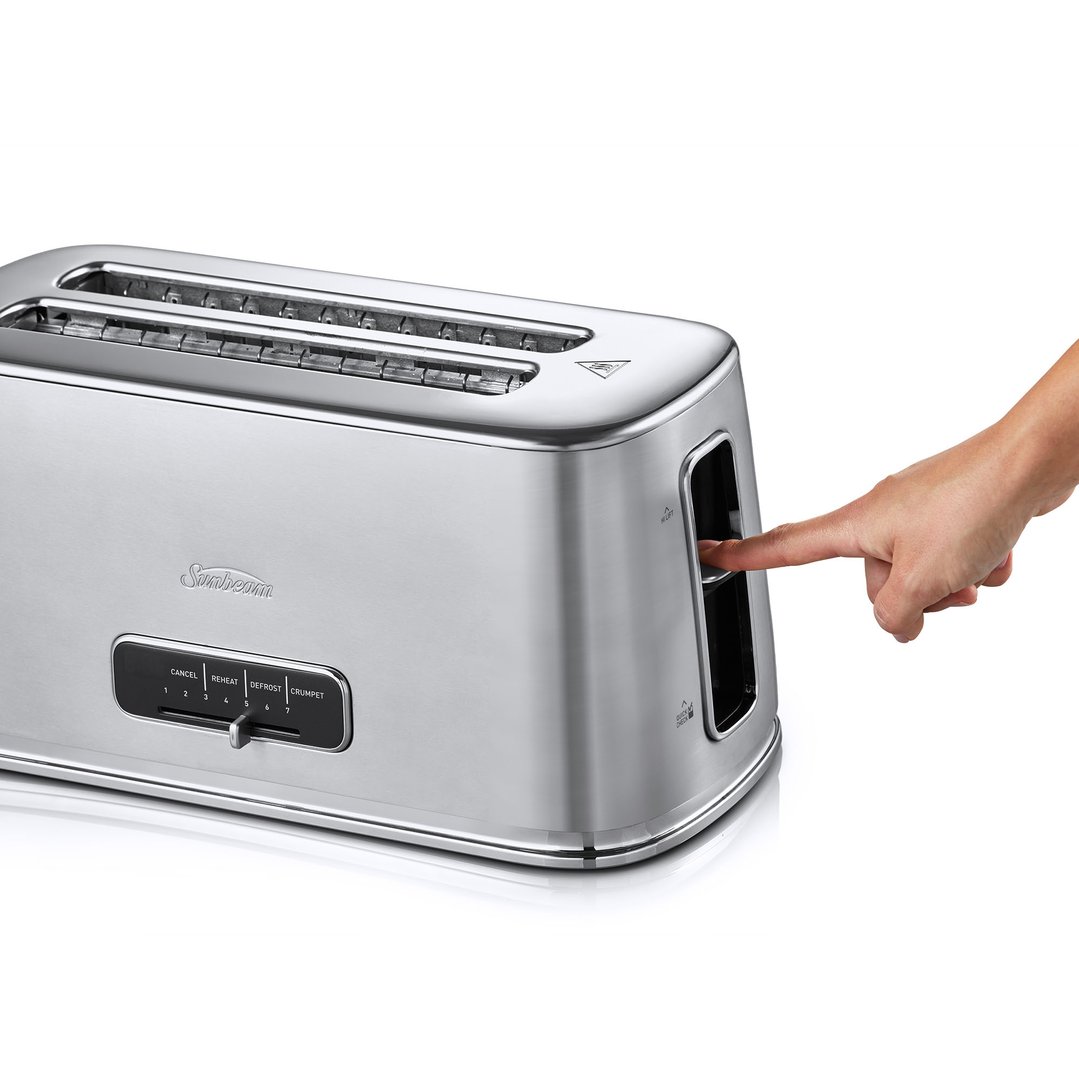 Hand pressing the lever on a stainless steel Sunbeam toaster