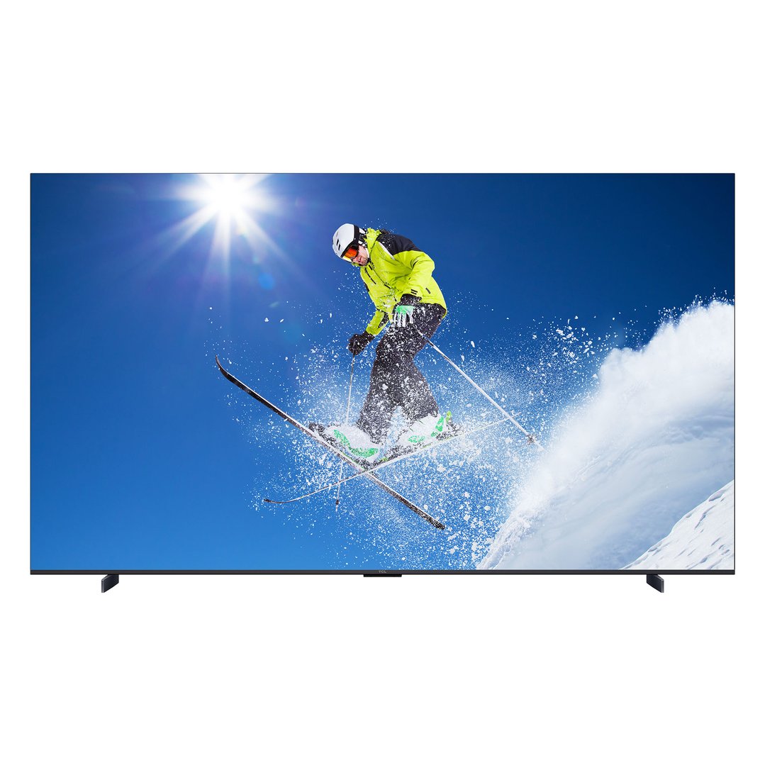 Television displaying a skier in mid-air against a bright blue sky