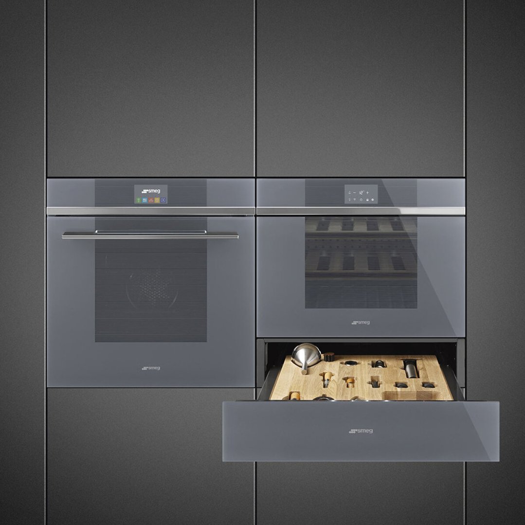 Two built-in ovens and a wine cellar with an open accessory drawer