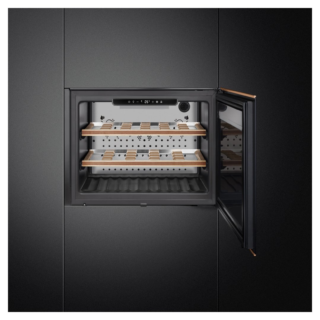 Built-in wine cooler with door open, showing wooden shelves inside a dark kitchen