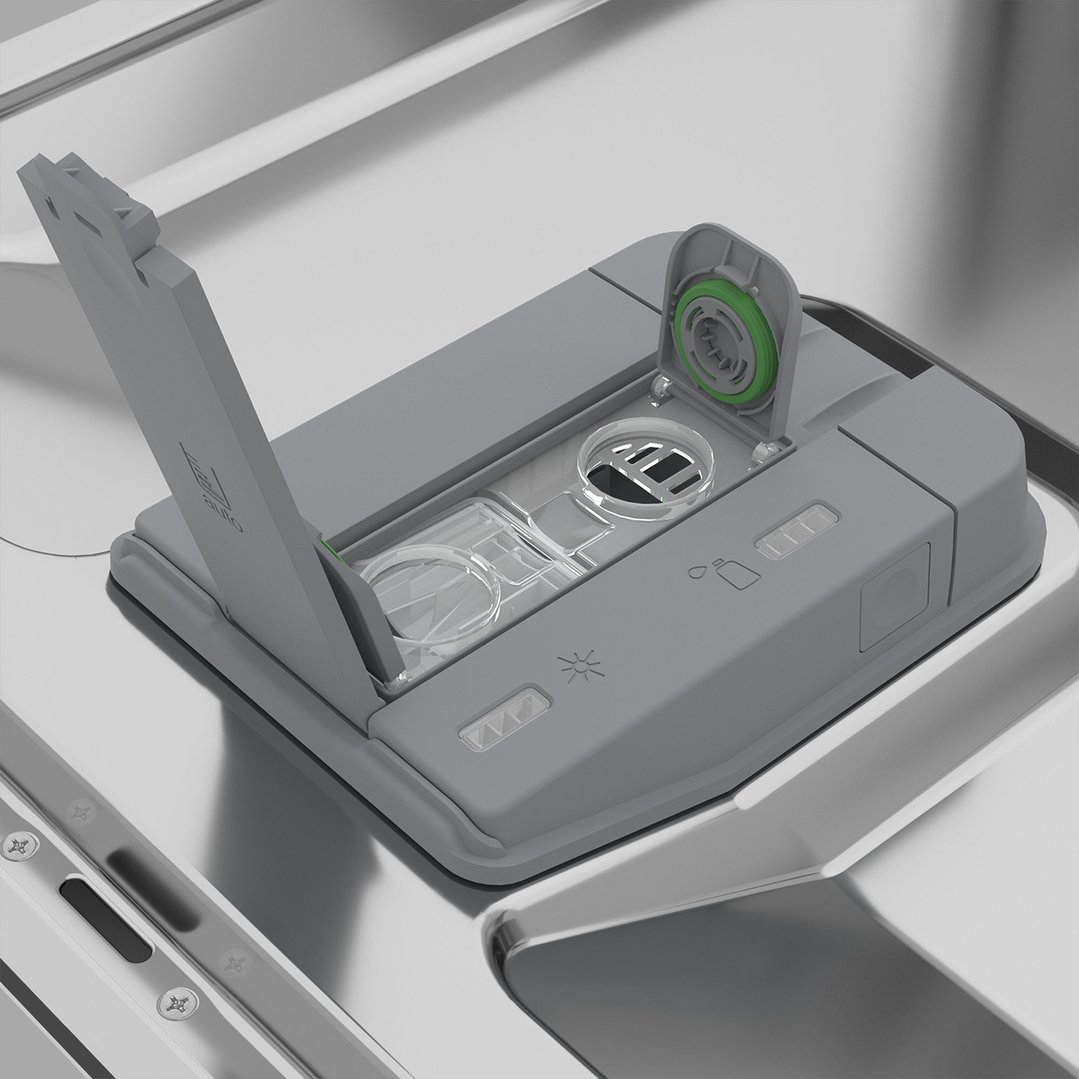 Close-up of a dishwasher's open detergent and rinse aid dispenser