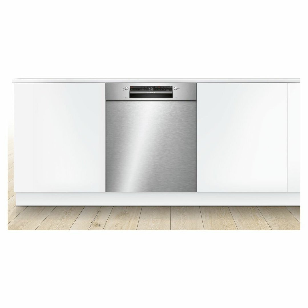 Built-under Bosch dishwasher integrated into white kitchen cabinetry with wooden floor