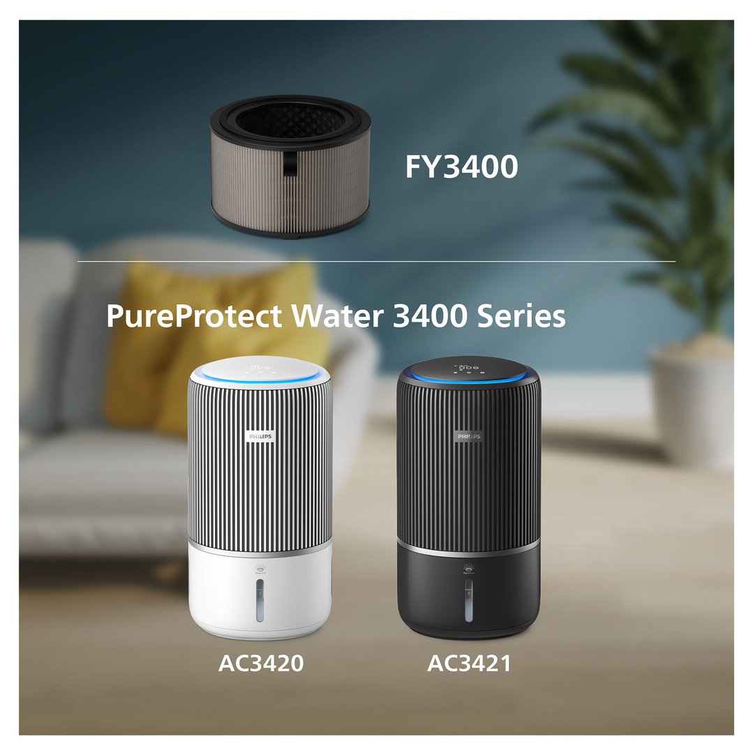 Two air purifiers, one white and one black, in a living room setting