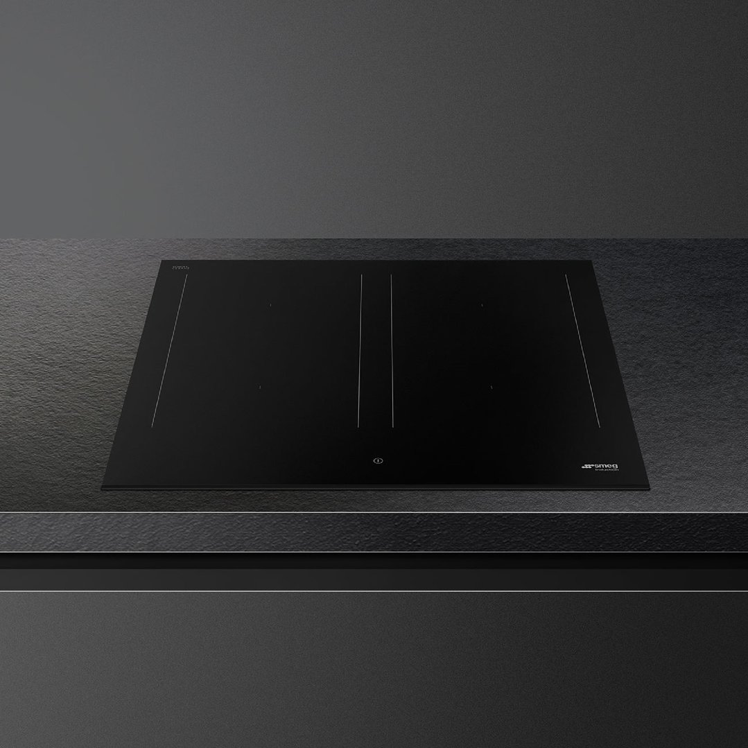 Black induction cooktop with controls on a dark countertop