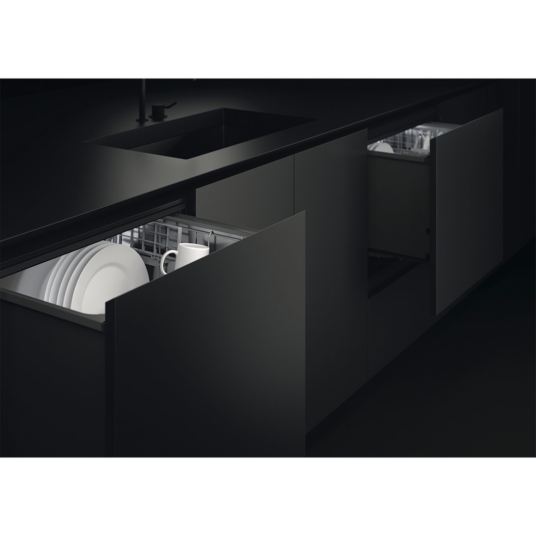 Two integrated DishDrawer dishwashers open in a dark modern kitchen setting