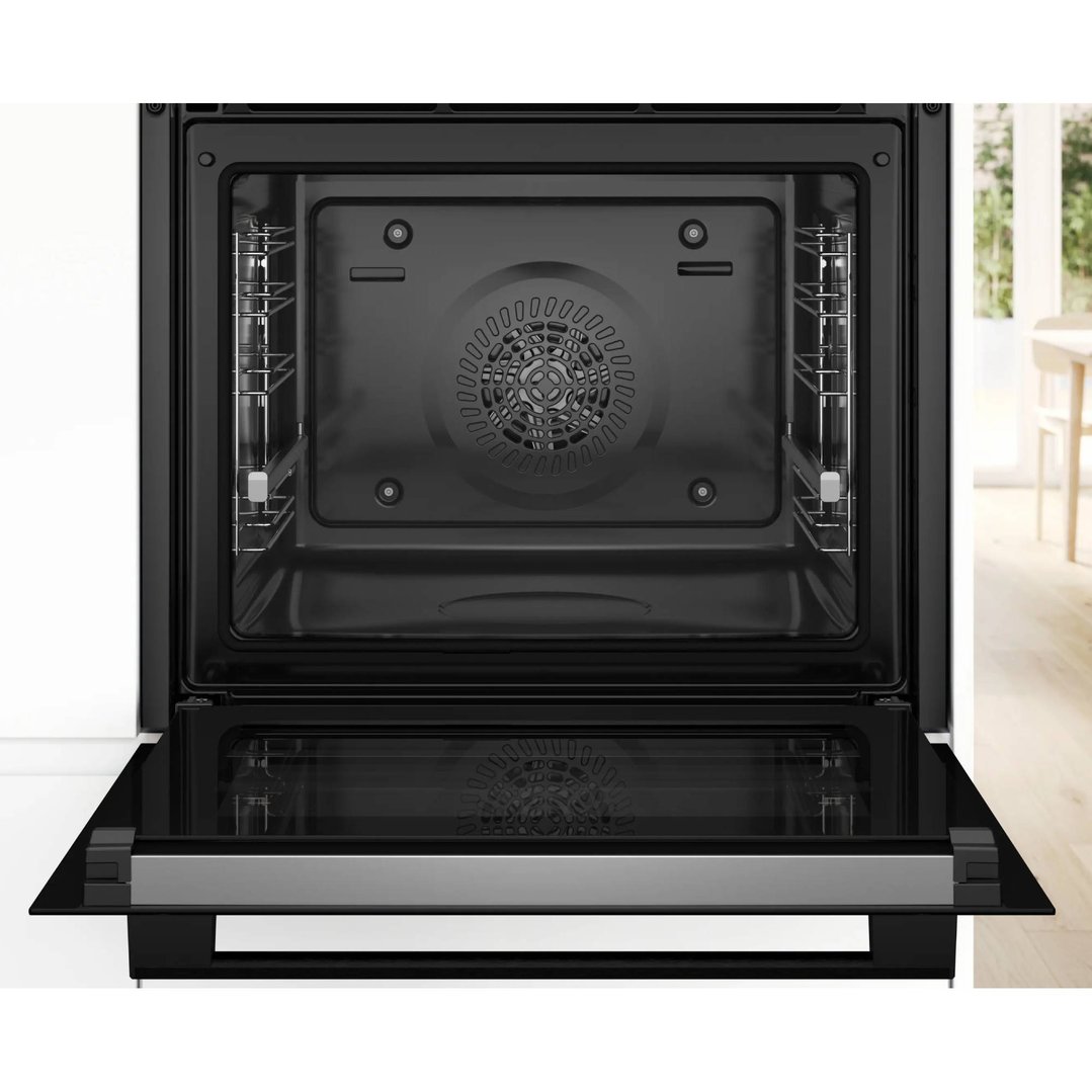Open black built-in oven with the door down in a kitchen setting