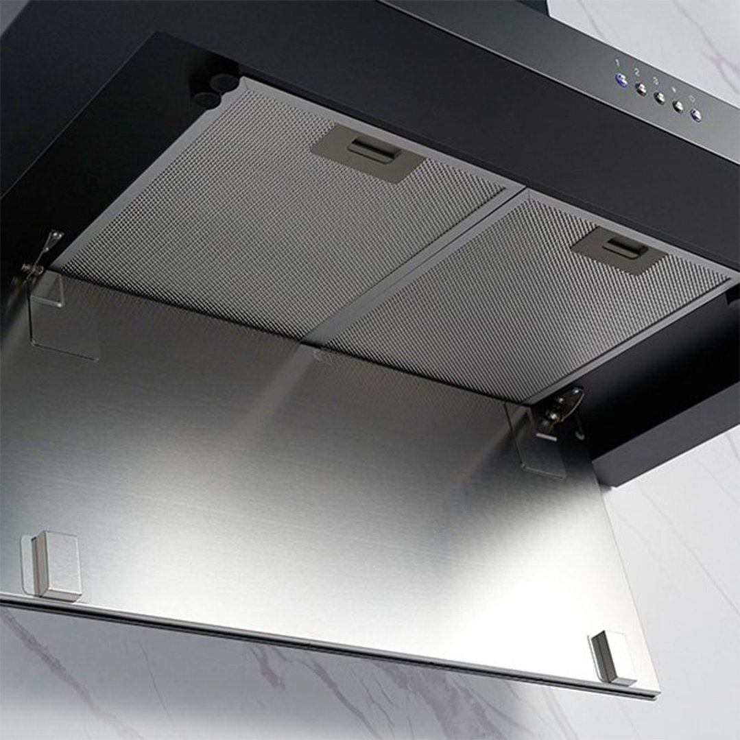 Close up of a black rangehood with its stainless steel panel open