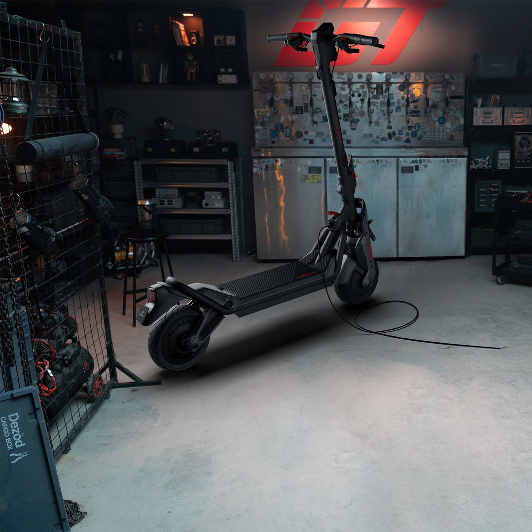 Ninebot GT3 Electric Super Scooter in a garage with tools and equipment