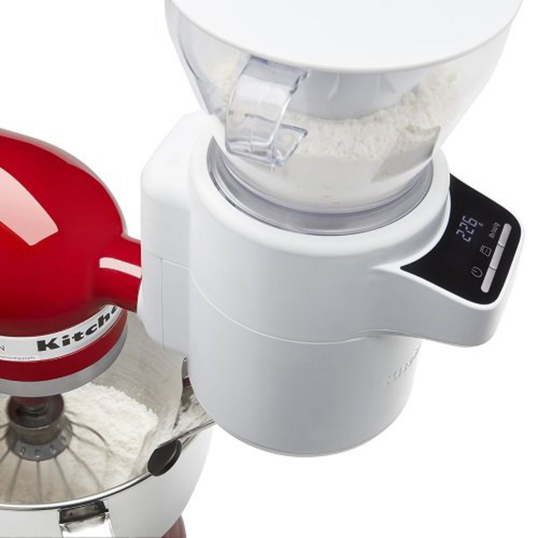 KitchenAid sifter and scale attachment pouring flour into a stand mixer