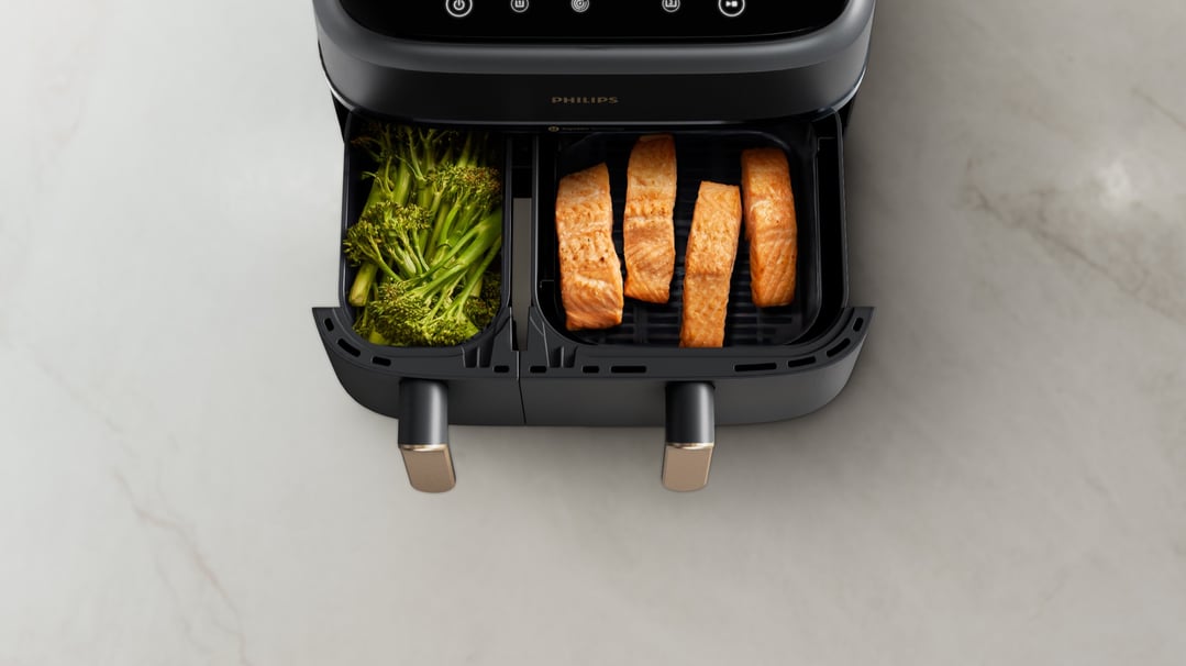 Philips 3000 Series Dual Basket Airfryer with broccoli and salmon on a counter