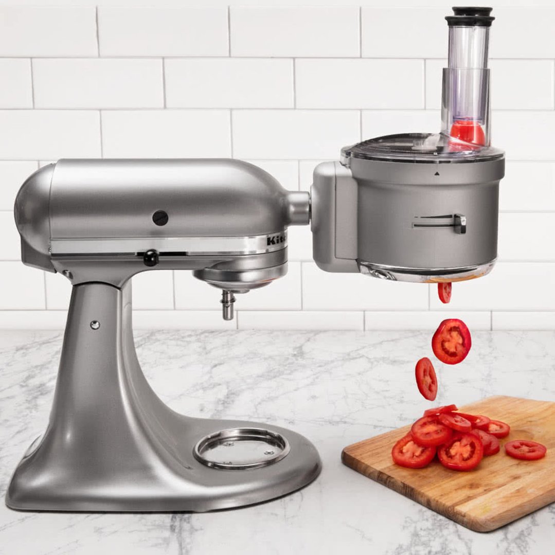 Food Processor Attachment slicing tomatoes on a KitchenAid stand mixer
