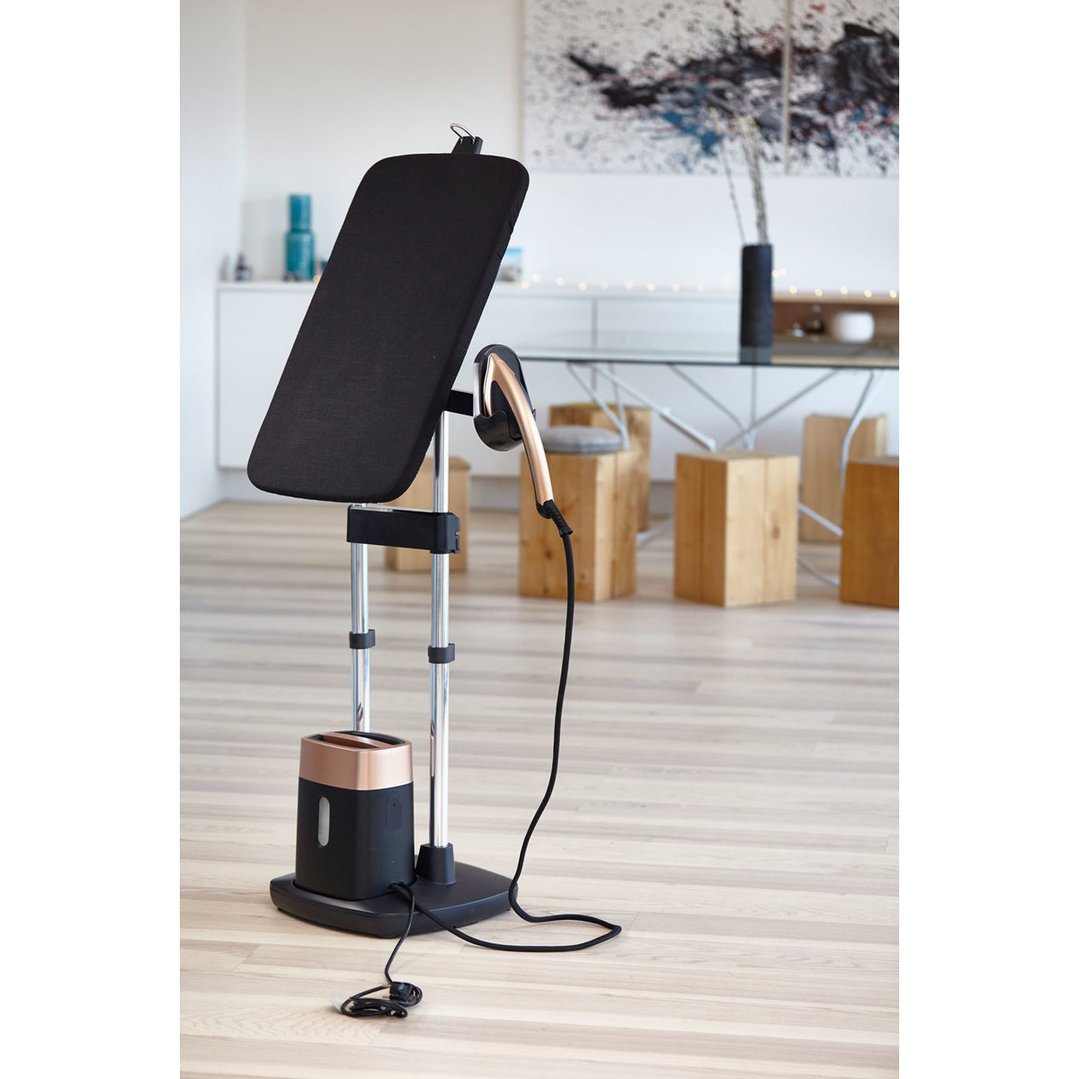All-in-one iron and garment care solution in a modern living room setting