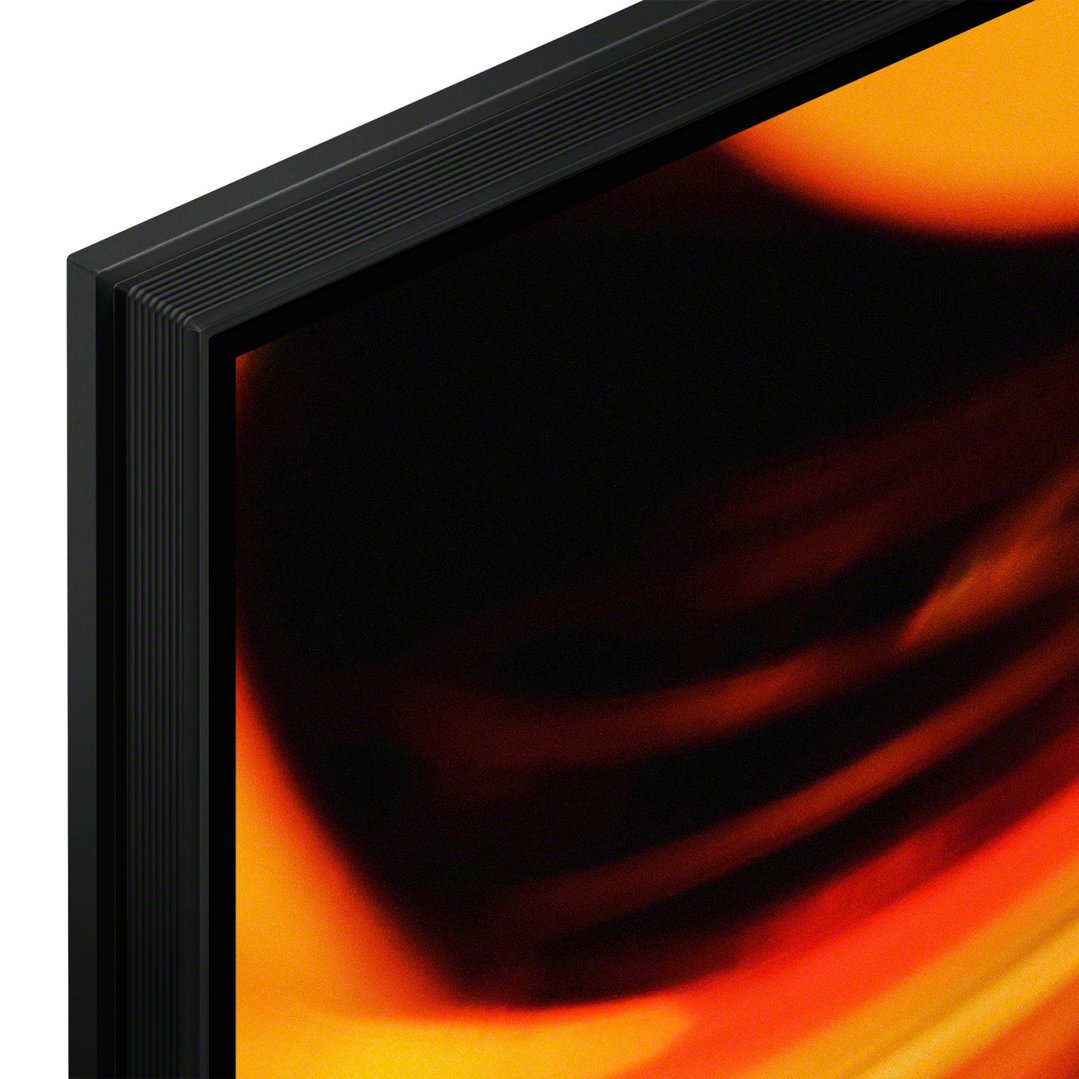 Close-up of the side and top bezel of a TV with a colorful screen