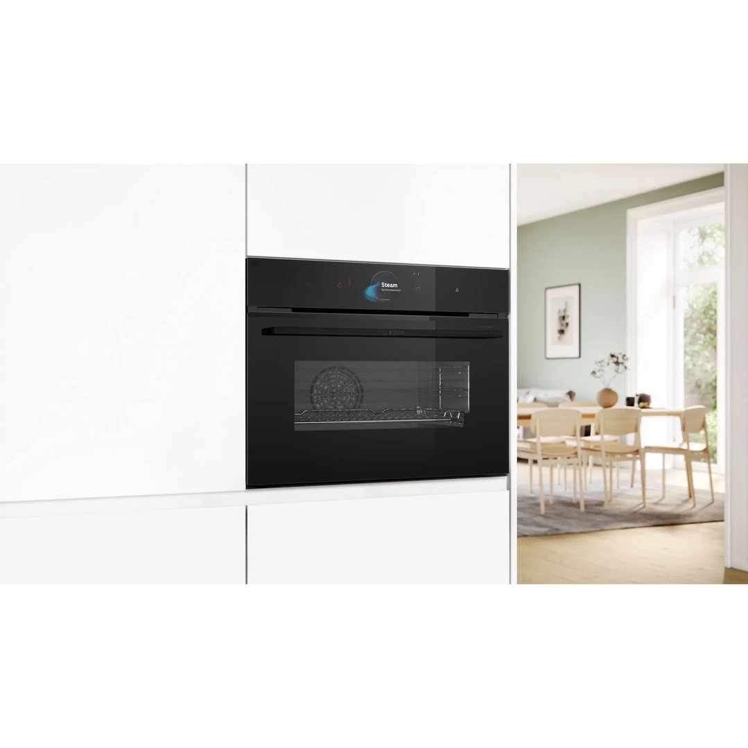 Built-in compact oven with steam function in a modern kitchen setting