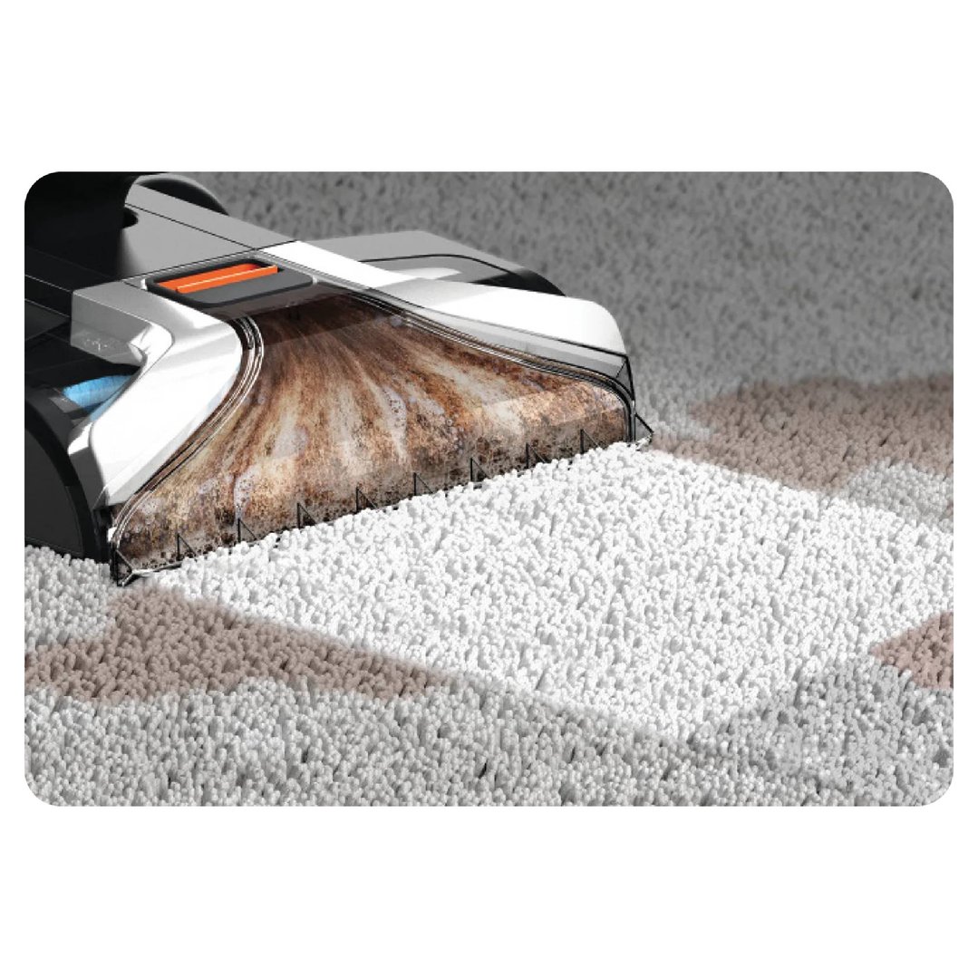 A carpet cleaner removing dirt from a white carpet, showing the dirty water