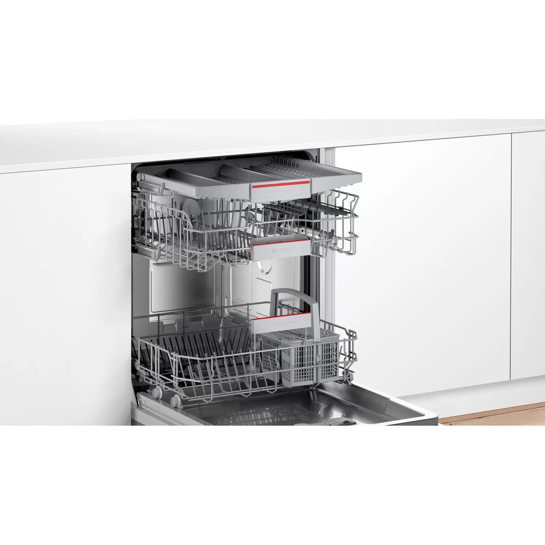 Built-under dishwasher with racks pulled out, showing interior in a kitchen setting
