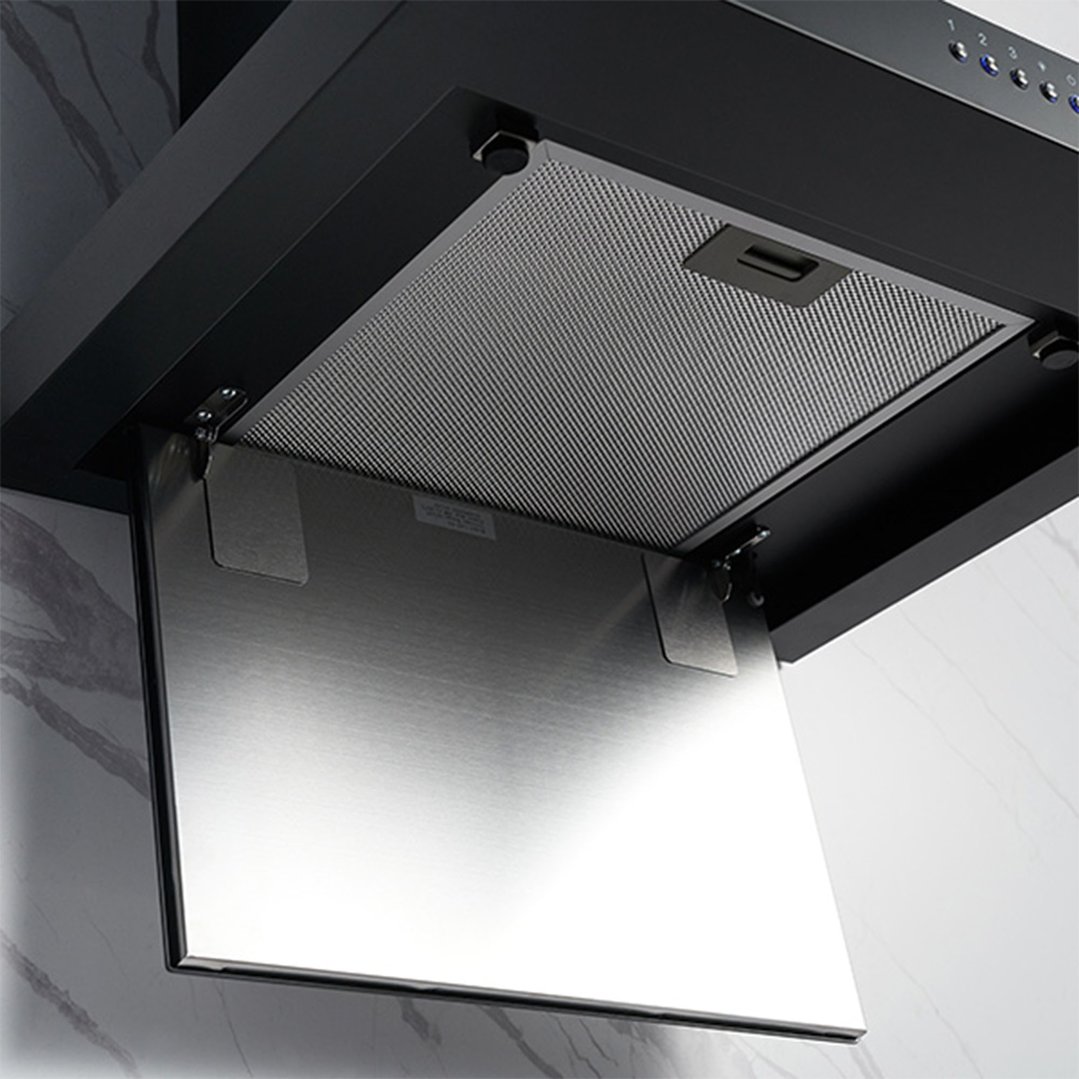 Black canopy rangehood with its filter panel open in a kitchen setting