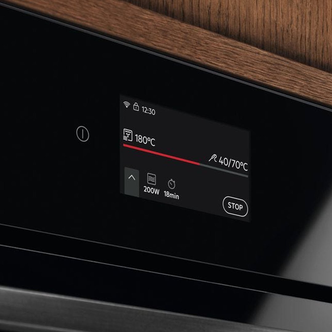 Close up of a microwave oven display showing cooking settings and time