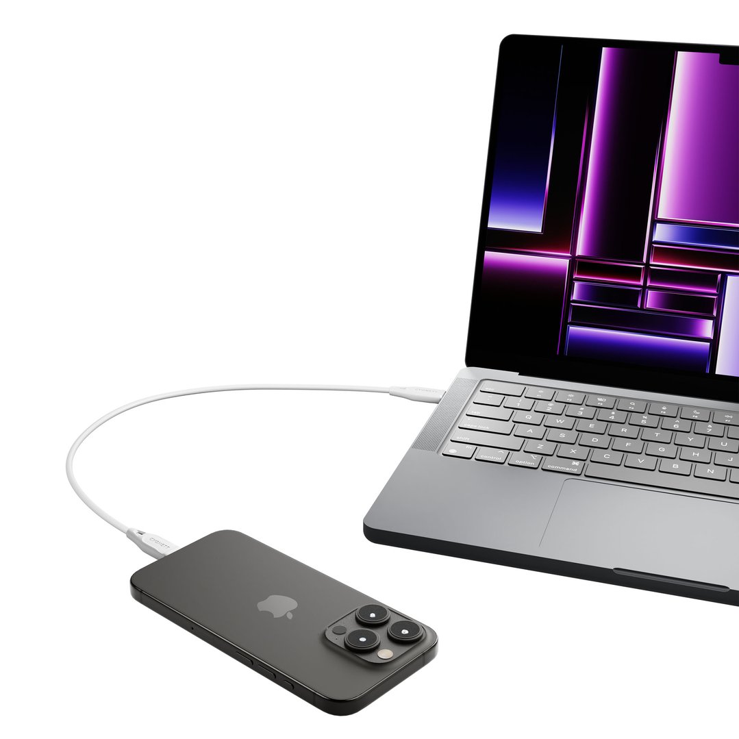 White Lightning to USB-C cable connecting a laptop and a smartphone