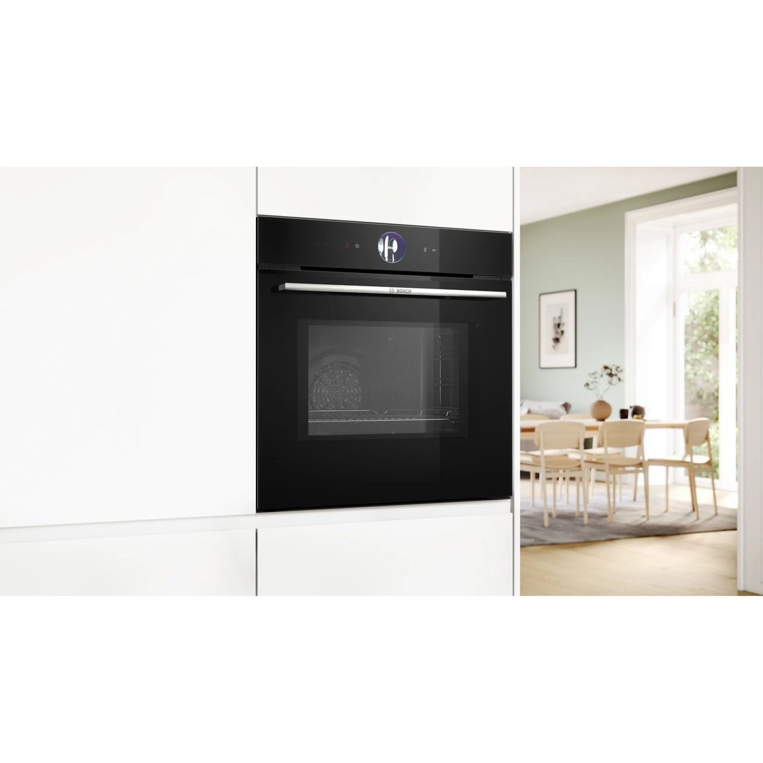 Black built-in oven with TFT Touch display in a modern kitchen setting