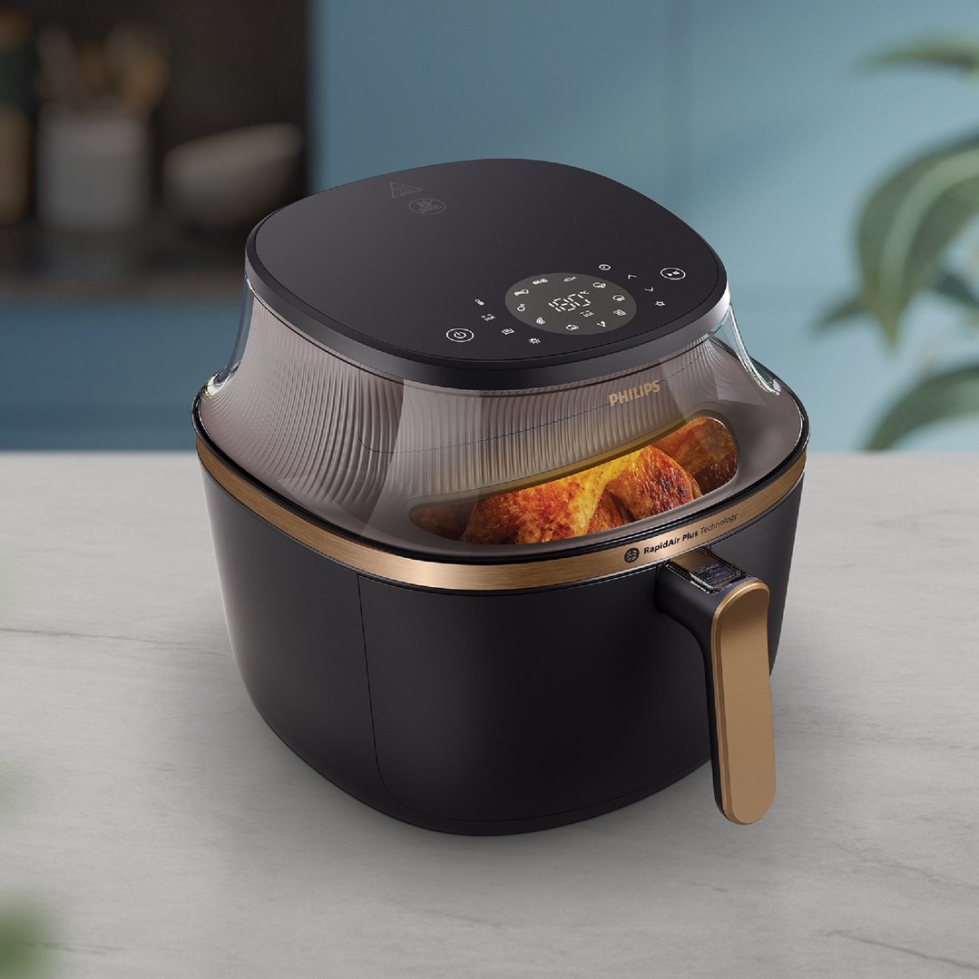 Philips 7.2L 3000 Series Airfryer with food inside on a kitchen counter