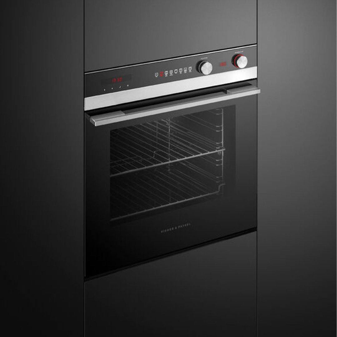 Built-in black oven with a stainless steel handle and control panel