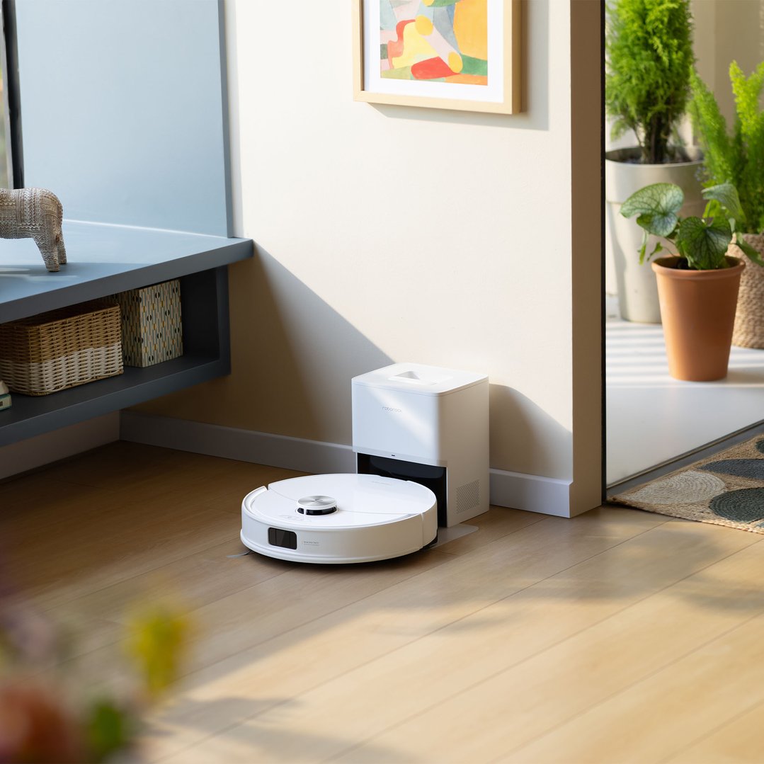 ROBOROCK Q10V Plus robotic vacuum cleaner with its dock in a living room