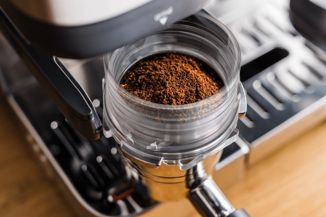 Close up of coffee grounds in the portafilter of a NINJA coffee machine