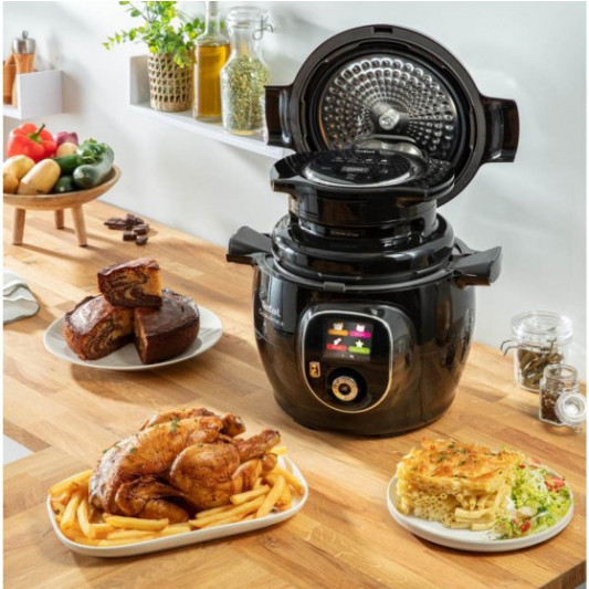 TEFAL Cook4me Accessory Extra Crisp Lid on a kitchen counter with various foods
