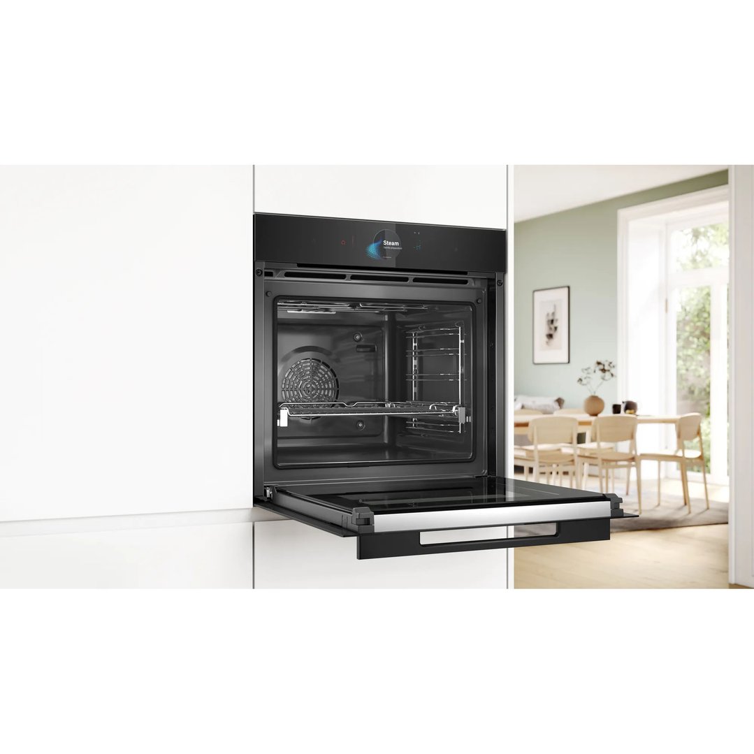 Built-in multifunction pyrolytic oven with door open in a modern kitchen setting