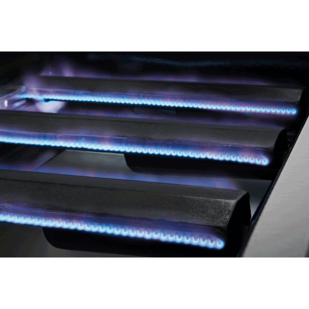 Close up of the blue flames from the burners of a barbecue