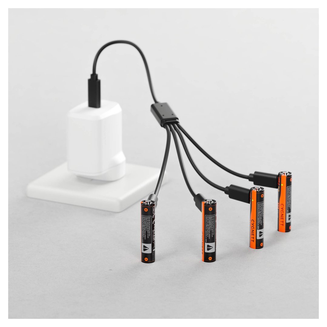 Four CYGNETT AAA USB-C rechargeable batteries charging from a wall adapter