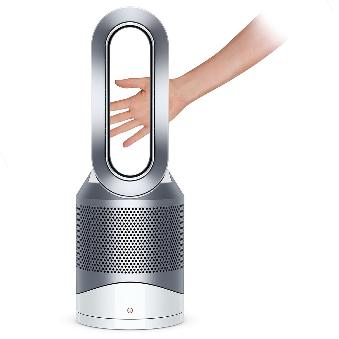 A hand reaching through the Dyson air purifier's loop amplifier