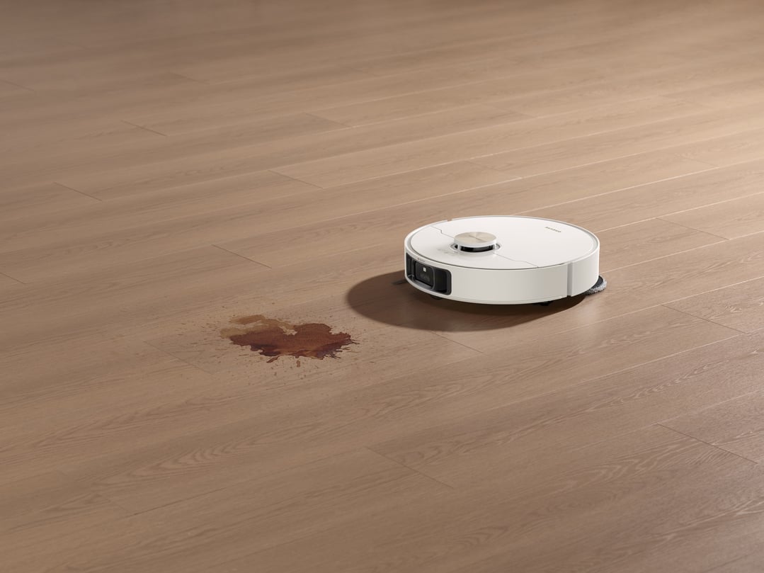 L50 Ultra Robot Vacuum and Mop cleaning a spill on a wooden floor