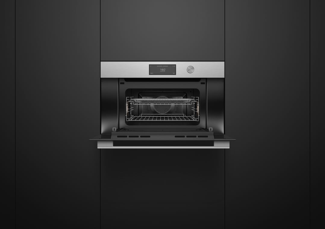 Built-in compact combi-steam oven with door open, showing interior and controls