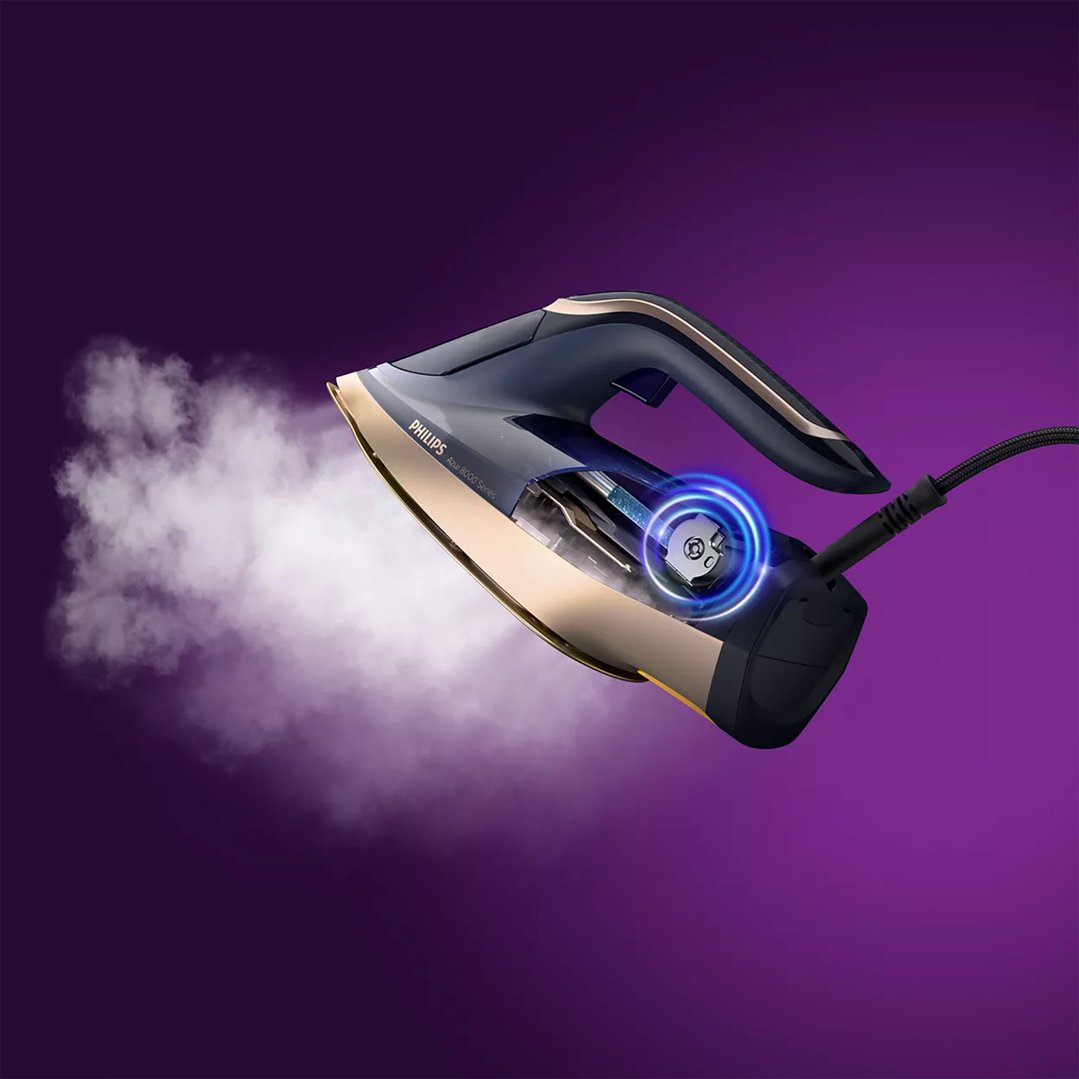 Philips Azur 8000 Series steam iron with steam emitting from the soleplate