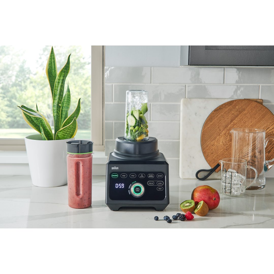 Braun PowerBlend 9 Jug Blender on a kitchen counter with fruits and a plant