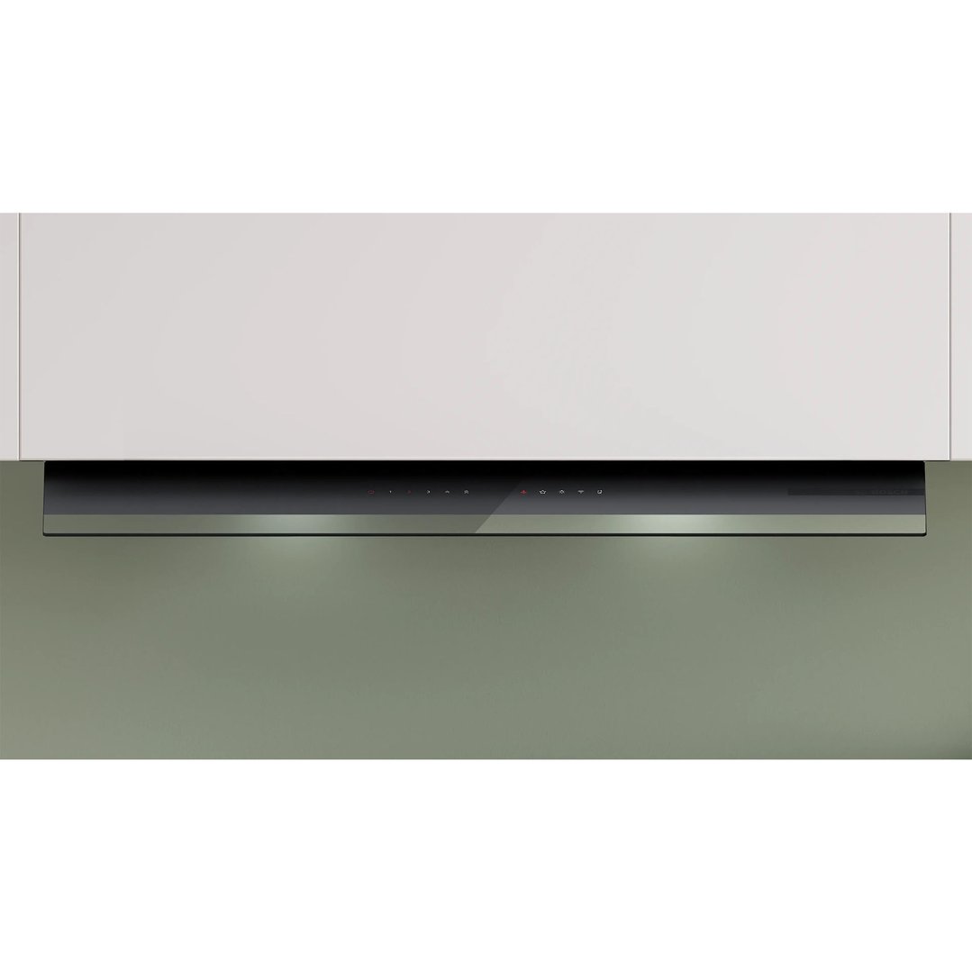 Integrated rangehood with illuminated controls installed under a white cabinet