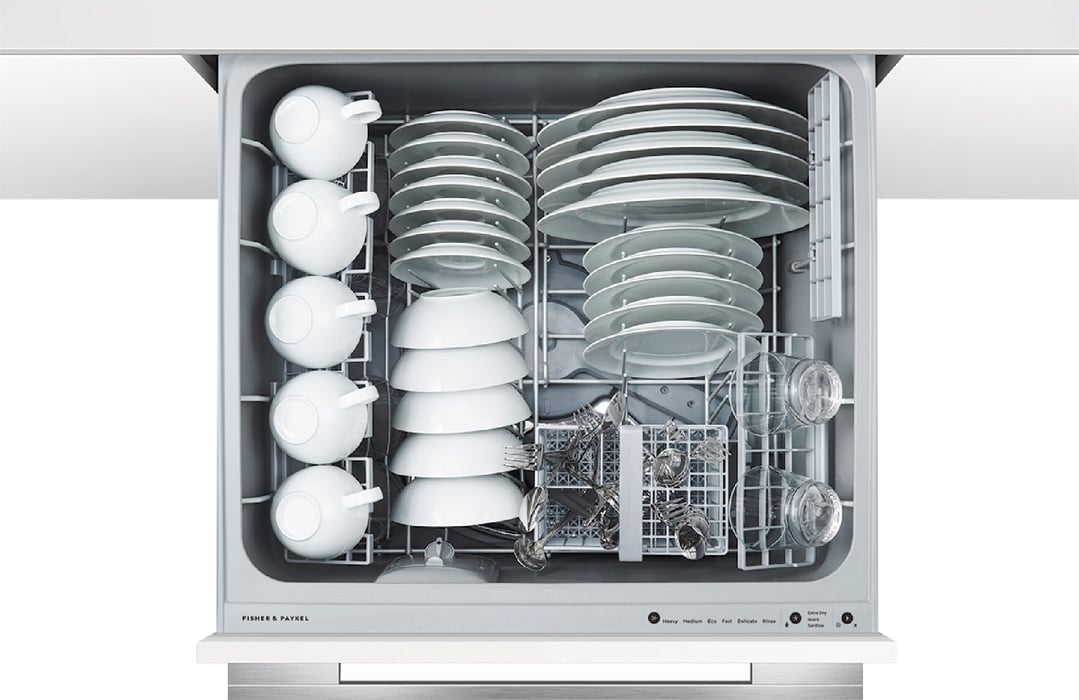 Top drawer of a Fisher & Paykel DishDrawer dishwasher filled with dishes