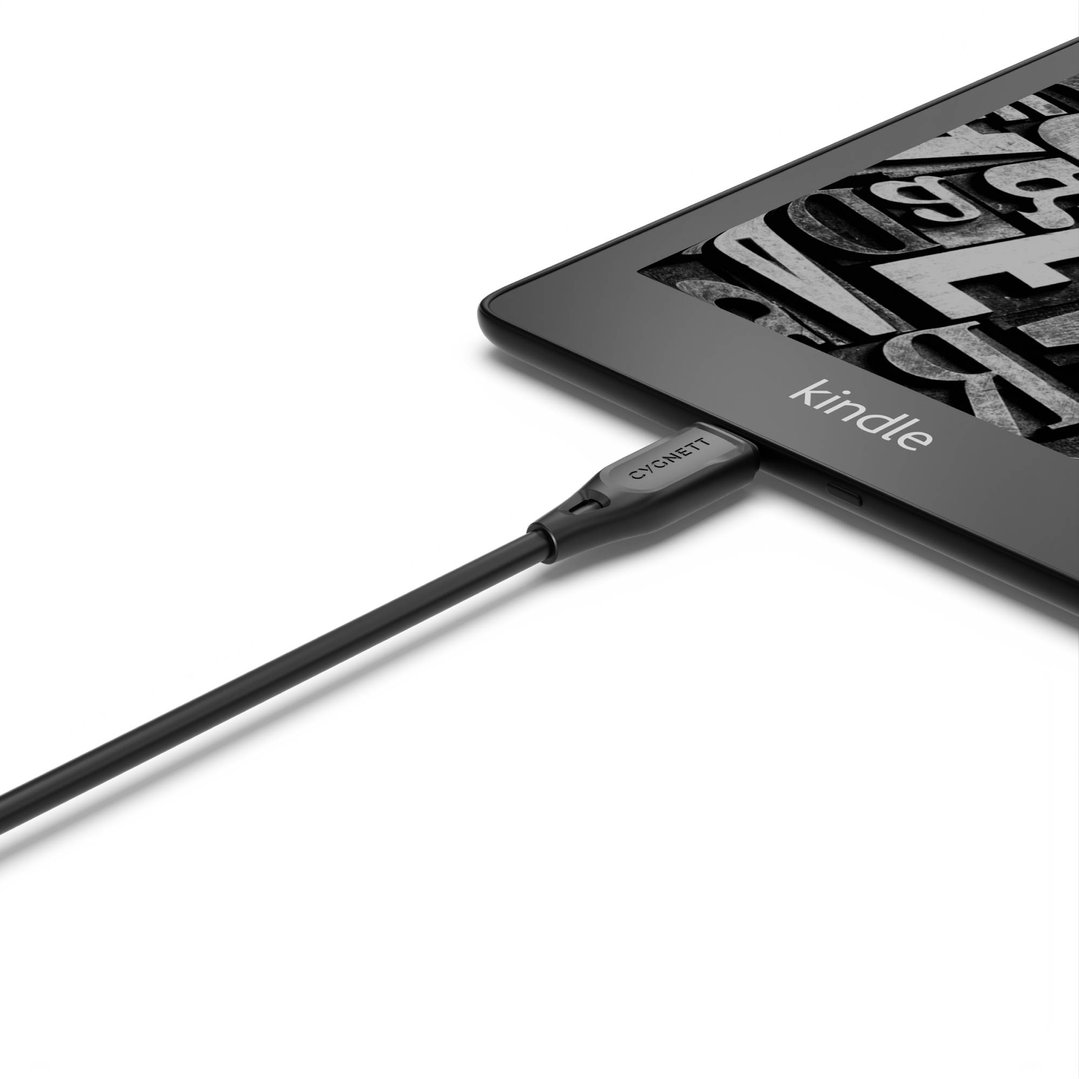 Black USB-A to Micro USB cable plugged into a Kindle e-reader