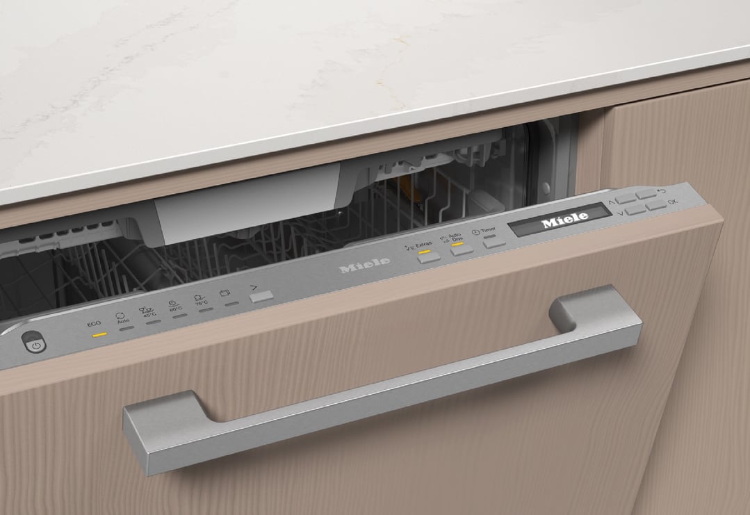 Open dishwasher with control panel visible, integrated into a light wood kitchen cabinet