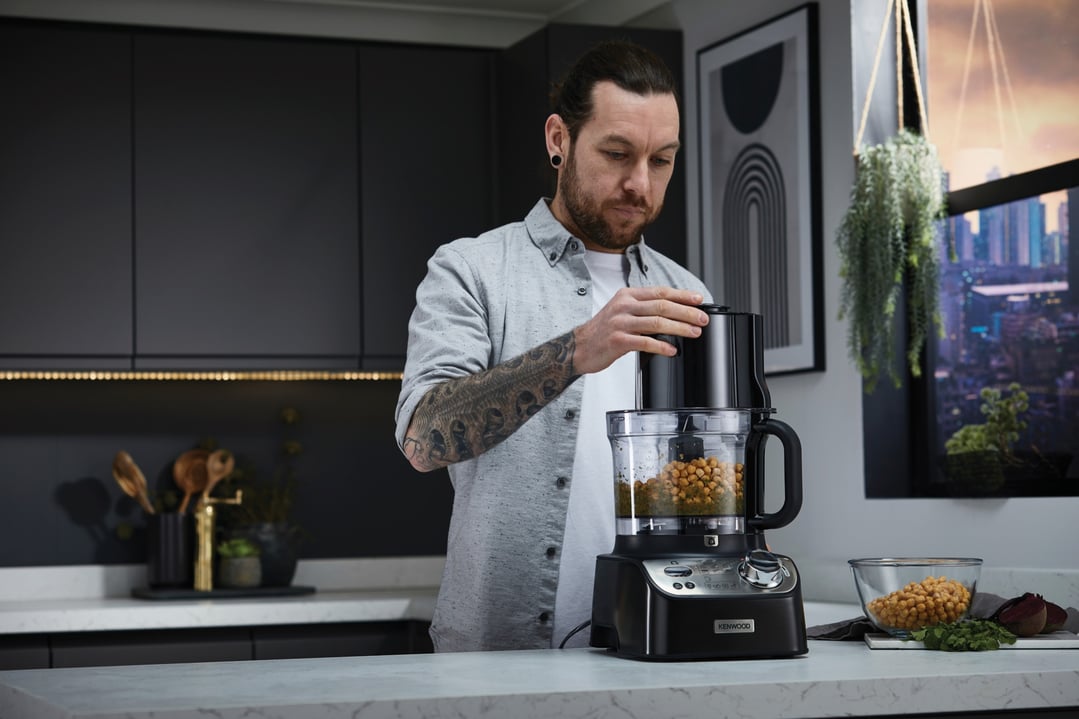 Man using a Kenwood MultiPro XL Weigh+ Food Processor in a modern kitchen