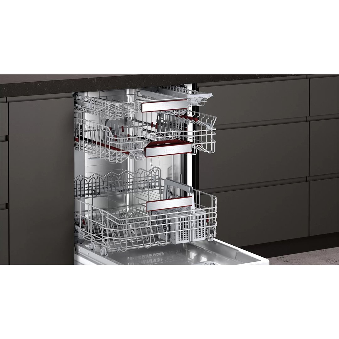 Open fully-integrated dishwasher with racks pulled out in a modern kitchen
