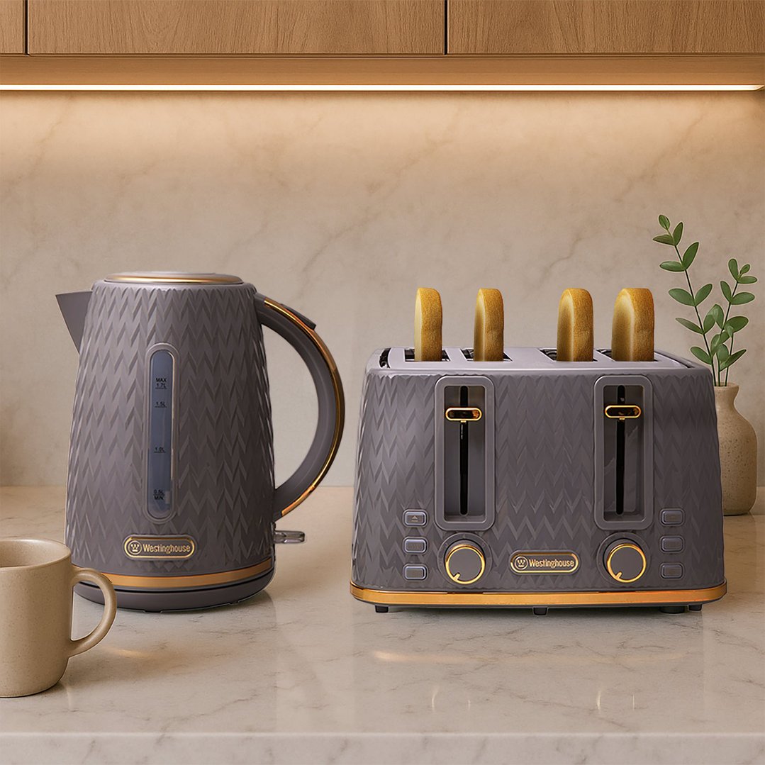 Grey and gold kettle and toaster set on a kitchen counter with toast
