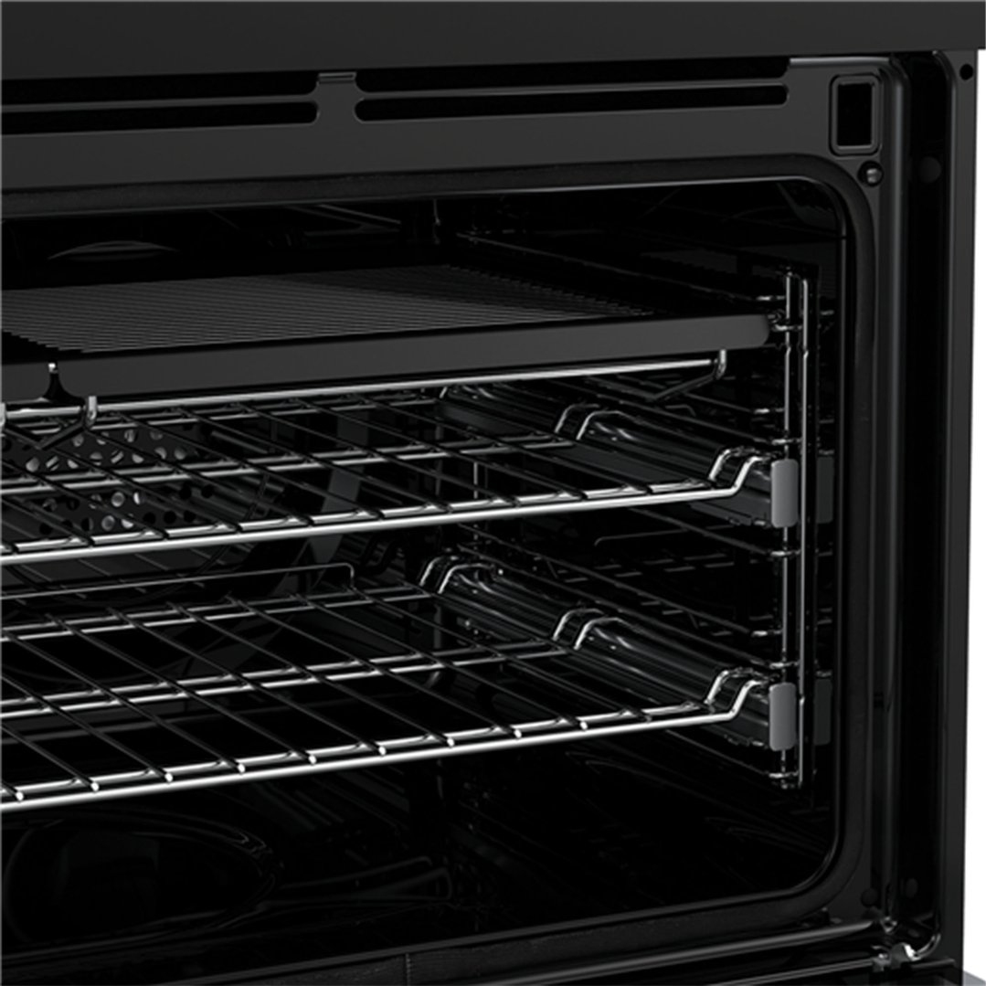 Close up of the interior of an oven with racks and runners